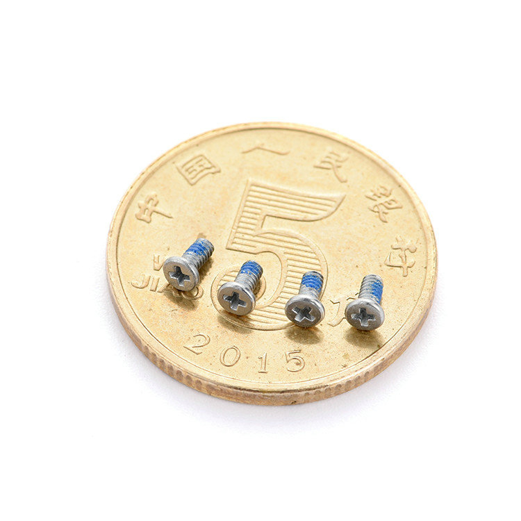 Mikro zajišťovací šroub M1,2X3mm křížová uhlíková ocel s plochou hlavou